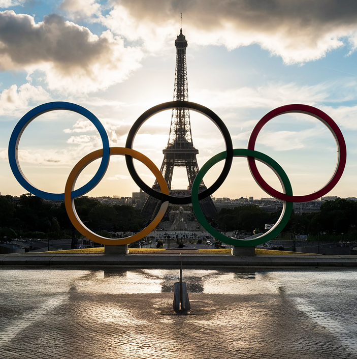 Paris skyline featuring the iconic Olympic rings symbolizing the return of the games