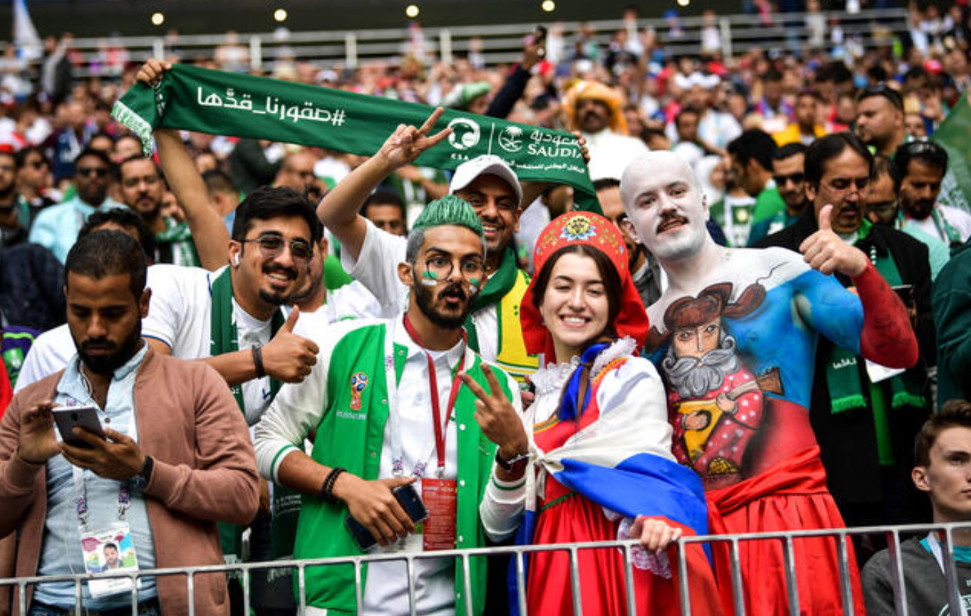 Sports fans in the Middle East watching a game, reflecting local betting interests