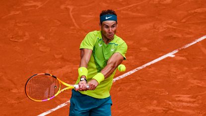  Young Rafael Nadal in action on a clay court, showcasing his early dominance.